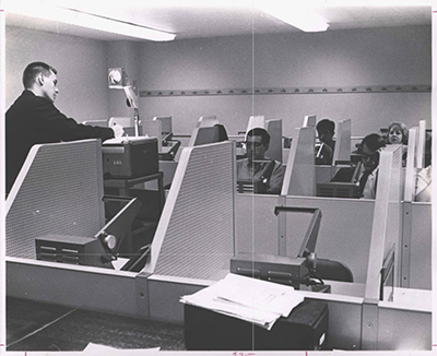 Student using reading machine carrels