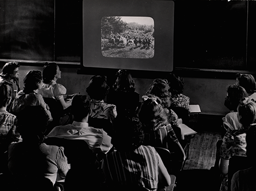 Image of class using slides in history class, 1939