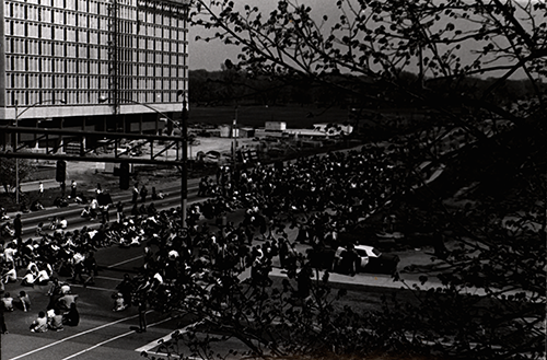 Image of anti-war protesters sitting on Lincoln Way in Campustown